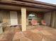 Inviting front porch with tiled floor, sitting area and access to the front door at 4026 E Catalina Cir, Mesa, AZ 85206