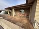 Inviting front porch with tiled floor, sitting area and view of the well maintained desert landscaping at 4026 E Catalina Cir, Mesa, AZ 85206