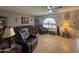 Cozy living room with tile floors, fan and seating area for the Gathering at 4026 E Catalina Cir, Mesa, AZ 85206