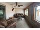 Inviting sunroom featuring a ceiling fan, comfortable seating, and natural light at 4026 E Catalina Cir, Mesa, AZ 85206