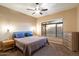 Cozy bedroom with a comfortable queen-size bed, soft lighting, and neutral decor at 4317 E Williams Dr, Phoenix, AZ 85050