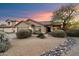 Charming single-story home featuring a well-manicured front yard and a two car garage at 4317 E Williams Dr, Phoenix, AZ 85050