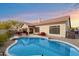 Inviting backyard pool with patio seating and lush landscaping, perfect for relaxing and entertaining outdoors at 4317 E Williams Dr, Phoenix, AZ 85050