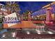 The District at Desert Ridge Marketplace with a decorative water feature and building facade at night at 4317 E Williams Dr, Phoenix, AZ 85050