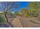 Scenic walking path through a park-like setting with trees and well-maintained landscaping at 4317 E Williams Dr, Phoenix, AZ 85050