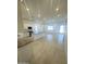 Open kitchen and living space features a center island and plenty of natural light at 43527 N Wollemi St, Queen Creek, AZ 85140