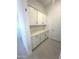 A well-lit storage or pantry area features modern cabinets, drawers and countertops at 43527 N Wollemi St, Queen Creek, AZ 85140