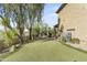 Lush backyard featuring a putting green, seating, and desert landscaping at 4534 E Oberlin Way, Cave Creek, AZ 85331