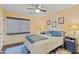 Bedroom with a ceiling fan, blue rug, and a large window at 4534 E Oberlin Way, Cave Creek, AZ 85331