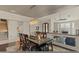 Bright dining area with chandelier lighting, wood floors, and views to living spaces at 4534 E Oberlin Way, Cave Creek, AZ 85331