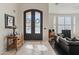 Welcoming foyer with decorative tile, glass double doors, and an inviting entryway to living room at 4534 E Oberlin Way, Cave Creek, AZ 85331