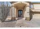 Inviting front entrance with a decorative glass double door and mature desert landscaping at 4534 E Oberlin Way, Cave Creek, AZ 85331