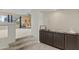 Hallway with carpeted stairs and built-in cabinets leading to a brightly lit living space at 4534 E Oberlin Way, Cave Creek, AZ 85331