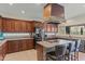 Spacious kitchen featuring an island, stainless steel appliances, and custom wood cabinetry at 4534 E Oberlin Way, Cave Creek, AZ 85331