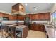 Open kitchen with center island, stainless steel appliances, and plentiful wood cabinets at 4534 E Oberlin Way, Cave Creek, AZ 85331