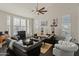 Cozy living room with a ceiling fan, large windows, and comfortable seating at 4534 E Oberlin Way, Cave Creek, AZ 85331