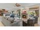 Open-concept living room featuring a stone fireplace and access to the outdoor patio at 4534 E Oberlin Way, Cave Creek, AZ 85331