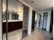 Bright bathroom featuring dual sinks, granite countertops, and large mirror at 5124 N 31St Pl # 542, Phoenix, AZ 85016