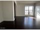 Bedroom with wood floors and a large window and closet at 5124 N 31St Pl # 542, Phoenix, AZ 85016