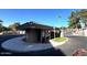 Community entrance with a gate and guard house at 5124 N 31St Pl # 542, Phoenix, AZ 85016