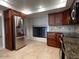 Kitchen with stainless steel fridge and matching wood cabinets at 5124 N 31St Pl # 542, Phoenix, AZ 85016