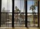 Large window view of a lake surrounded by trees at 5124 N 31St Pl # 542, Phoenix, AZ 85016