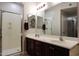 Primary bathroom with a double sink vanity, shower and large mirror at 5350 E Deer Valley Dr # 4430, Phoenix, AZ 85054