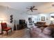 Comfortable living room featuring a ceiling fan, wood floors, and an open layout at 5350 E Deer Valley Dr # 4430, Phoenix, AZ 85054