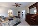 Spacious main bedroom featuring a ceiling fan, adjacent hallway and stylish furnishings at 5350 E Deer Valley Dr # 4430, Phoenix, AZ 85054