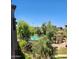 Community pool with lounging areas and shade trees for residents to enjoy at 5350 E Deer Valley Dr # 4430, Phoenix, AZ 85054