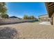 Large backyard area, featuring a gravel ground covering, covered patio, and turf at 5513 W Tierra Buena Ln, Glendale, AZ 85306