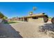 The backyard features a covered patio and new turf at 5513 W Tierra Buena Ln, Glendale, AZ 85306