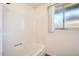 Bright bathroom with a tub and a window at 5513 W Tierra Buena Ln, Glendale, AZ 85306