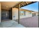 Inviting covered front entry with security door and decorative brick details at 5513 W Tierra Buena Ln, Glendale, AZ 85306