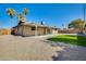 Exterior view of home with covered patio and landscaped backyard at 5513 W Tierra Buena Ln, Glendale, AZ 85306