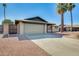 Charming single-story home featuring a two-car garage and desert landscaping at 5513 W Tierra Buena Ln, Glendale, AZ 85306