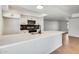 Kitchen featuring stone countertops, stainless steel appliances, modern backsplash, and an island at 5513 W Tierra Buena Ln, Glendale, AZ 85306