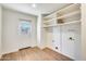 Laundry room with built-in shelves, and a door to the exterior at 5513 W Tierra Buena Ln, Glendale, AZ 85306