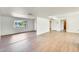 Bright living room showcasing wood-look flooring, recessed lighting, and an open floor plan at 5513 W Tierra Buena Ln, Glendale, AZ 85306