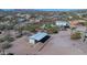 Aerial view of the property showcasing the horse stall, desert landscaping, and surrounding community at 5962 E Siesta St, Apache Junction, AZ 85119