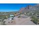 Aerial view of the property with stunning mountain backdrop and desert landscape at 5962 E Siesta St, Apache Junction, AZ 85119