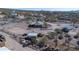 Aerial view of the property showcasing the horse stall, fencing, and desert landscape at 5962 E Siesta St, Apache Junction, AZ 85119