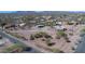 Aerial view of desert neighborhood featuring lush landscaping and mountain views at 5962 E Siesta St, Apache Junction, AZ 85119