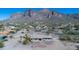 Aerial view of a charming desert home with lush desert landscaping at 5962 E Siesta St, Apache Junction, AZ 85119