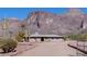 Desert home with mature landscaping and a stunning mountain backdrop at 5962 E Siesta St, Apache Junction, AZ 85119