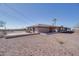 Single level ranch style home with desert landscaping and flat roof at 5962 E Siesta St, Apache Junction, AZ 85119