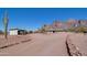 Exterior view of desert home with rock landscaping and mountain views at 5962 E Siesta St, Apache Junction, AZ 85119