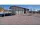 Exterior view of horse stall with metal fencing, desert landscaping, and black rubber matting at 5962 E Siesta St, Apache Junction, AZ 85119