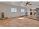 Open-concept living room with ceramic tile floors and bright natural light at 5962 E Siesta St, Apache Junction, AZ 85119