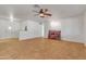 Open concept living room with neutral tile floors, white walls, and open floor plan at 5962 E Siesta St, Apache Junction, AZ 85119